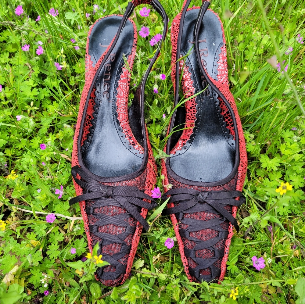 Red lace heels with black ribbon and bow